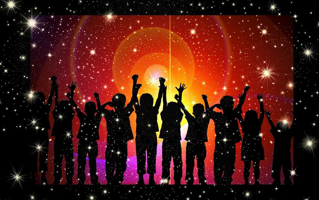 A group of children stand in silhouette with arms raised against a glowing starry orange and pink night sky background.