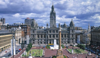 Aerial view of Glasgow City Chambers overlooking George Square with its central monument.